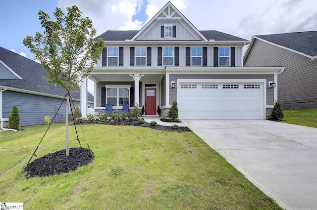 view of front of house featuring a garage and a front lawn