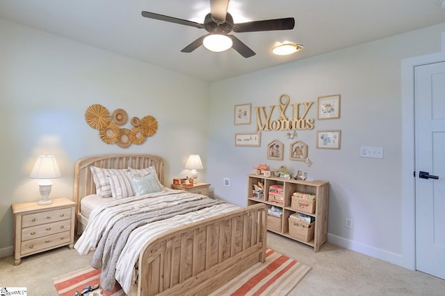 bedroom with light carpet and ceiling fan