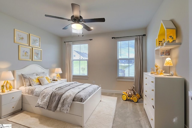 carpeted bedroom with ceiling fan