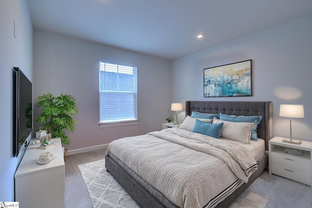 bedroom with light carpet