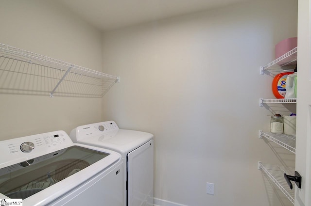 washroom featuring washer and dryer