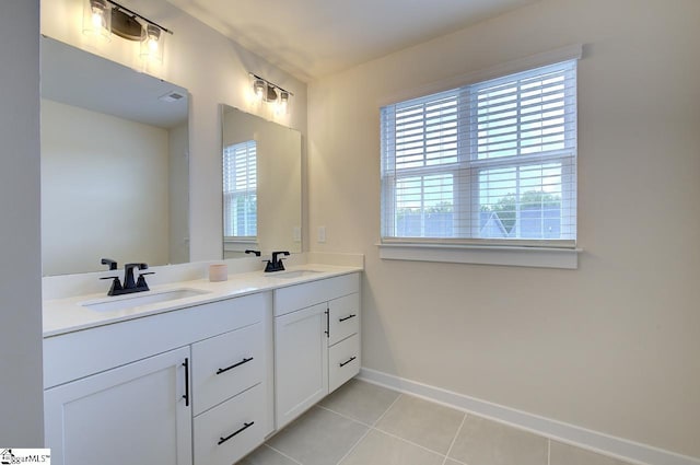 bathroom with tile patterned flooring and vanity