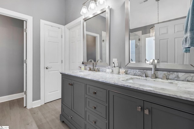 bathroom with hardwood / wood-style floors and vanity