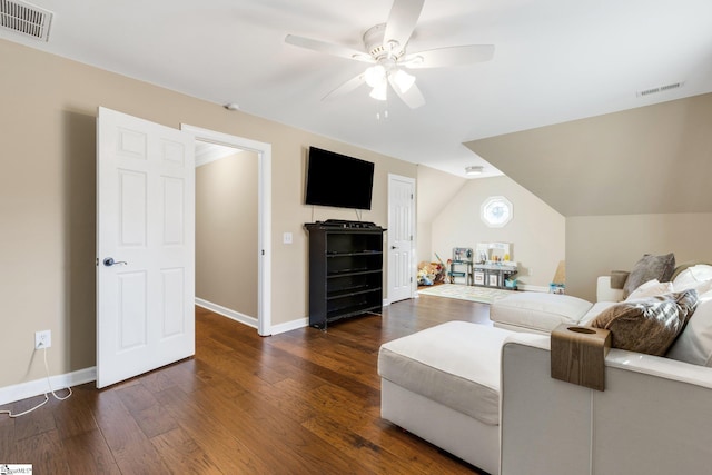 living room featuring dark hardwood / wood-style flooring, ceiling fan, and lofted ceiling