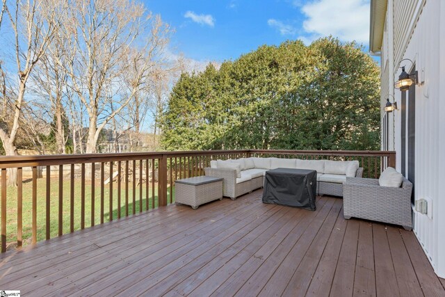 wooden terrace featuring an outdoor living space