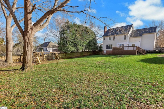 view of yard with a playground and a wooden deck