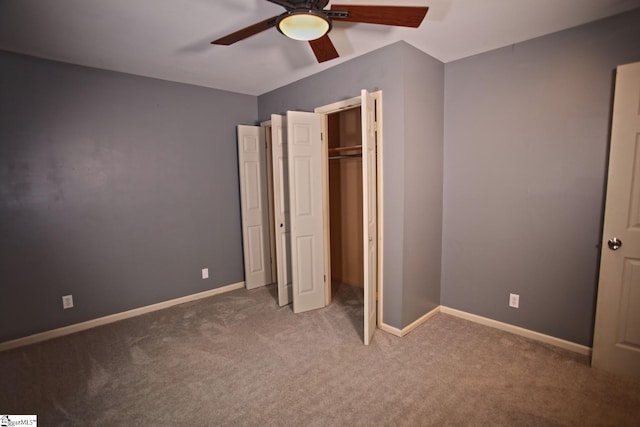 unfurnished bedroom with carpet, ceiling fan, and a closet