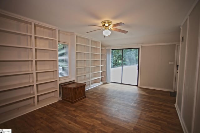 empty room featuring dark hardwood / wood-style flooring and ceiling fan