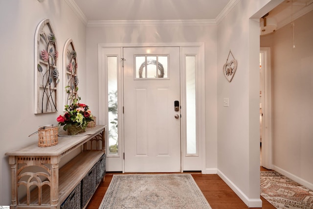 foyer with crown molding and dark hardwood / wood-style floors