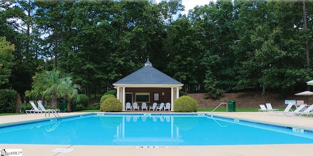 view of pool with a patio area and a gazebo
