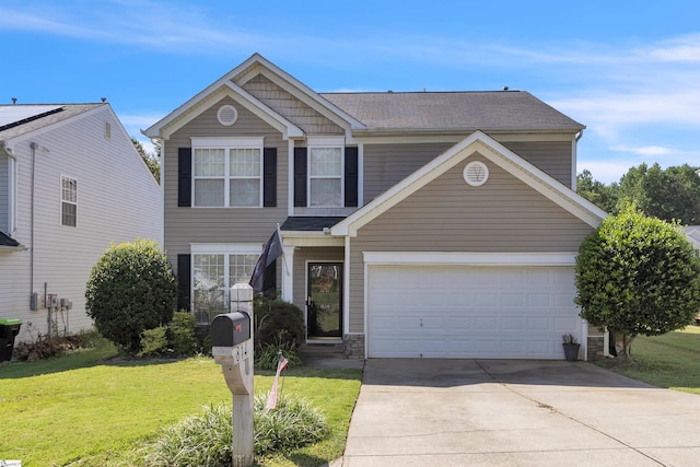 view of front of property featuring a garage and a front lawn