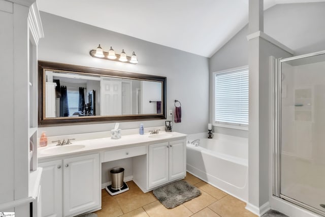 bathroom with tile patterned flooring, vanity, plus walk in shower, and vaulted ceiling