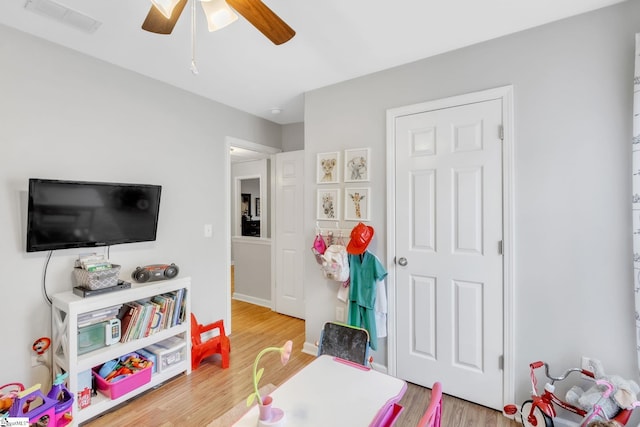 game room featuring ceiling fan and wood-type flooring