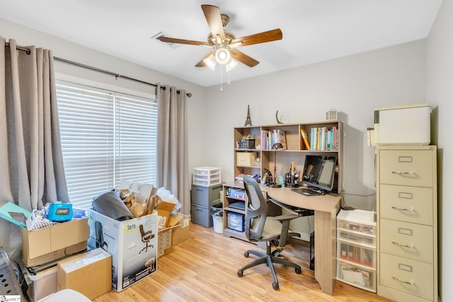 office with ceiling fan and light hardwood / wood-style floors