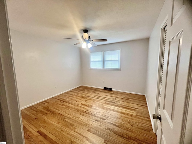 spare room with ceiling fan and light hardwood / wood-style floors