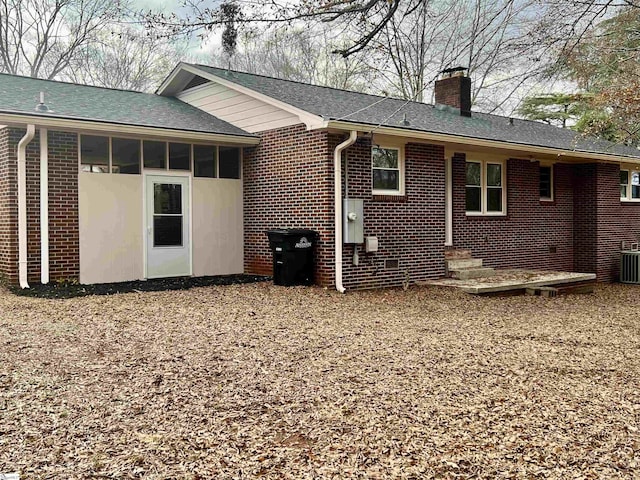 view of property exterior featuring a sunroom