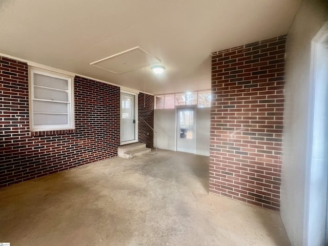 basement with brick wall