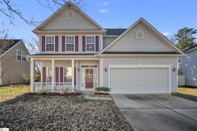 view of front of house with covered porch and a garage