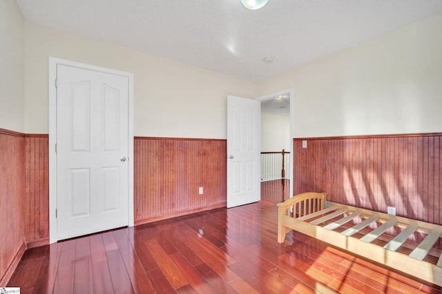 unfurnished bedroom featuring dark hardwood / wood-style floors