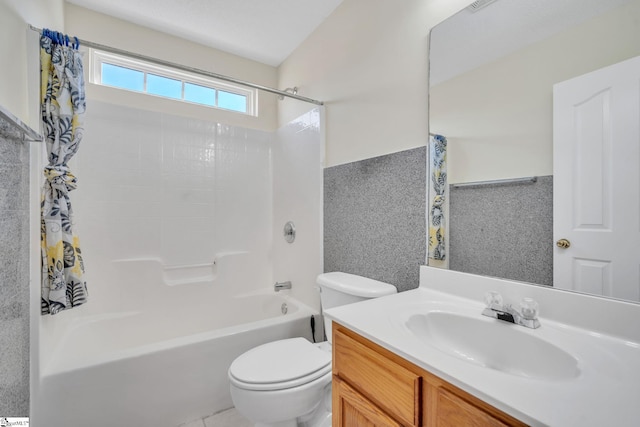 full bathroom featuring washtub / shower combination, vanity, and toilet