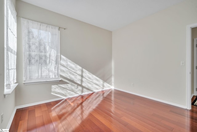 empty room featuring hardwood / wood-style floors