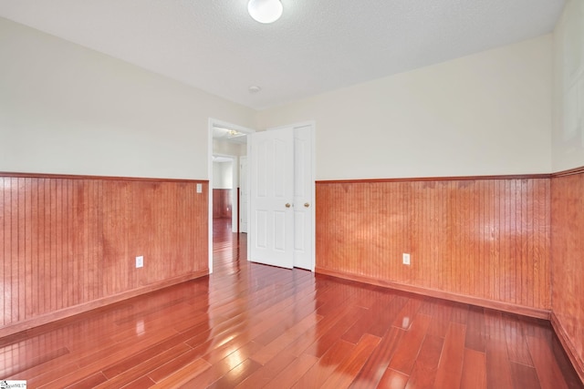 unfurnished room featuring wood-type flooring