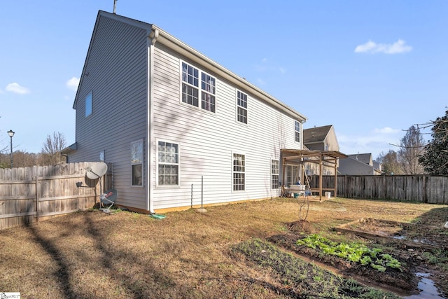 back of property with a sunroom