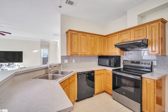 kitchen featuring decorative backsplash, ceiling fan, sink, black appliances, and light tile patterned floors