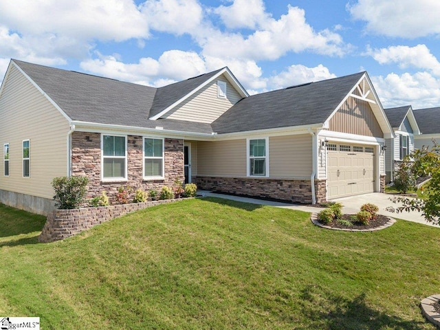 view of front of house with a front yard and a garage