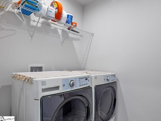 laundry area with washer and dryer