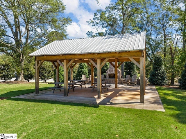 view of community with a gazebo, a patio area, and a yard