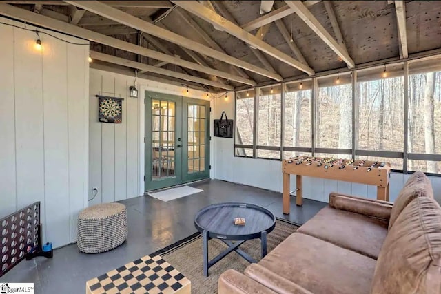 sunroom / solarium with lofted ceiling with beams and a wealth of natural light