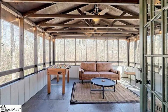 sunroom / solarium featuring ceiling fan and lofted ceiling