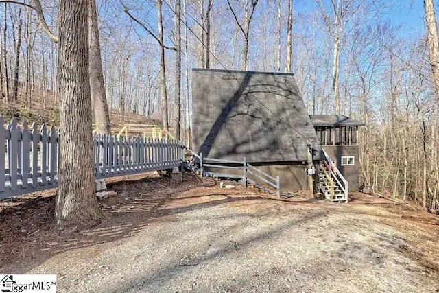 view of side of property with a deck