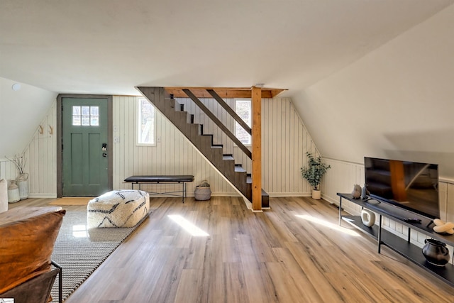 interior space with lofted ceiling and light wood-type flooring