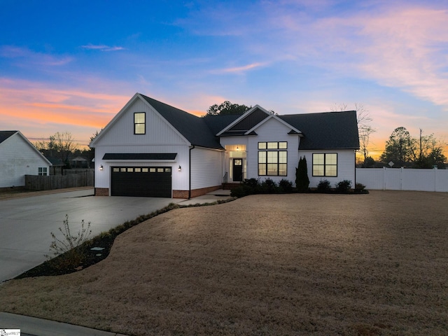 modern inspired farmhouse featuring a garage