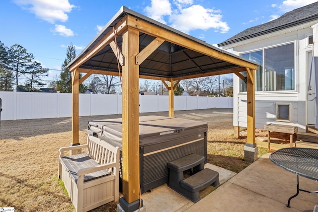 view of patio / terrace with a gazebo and a hot tub