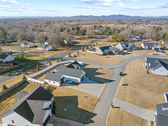 birds eye view of property featuring a mountain view