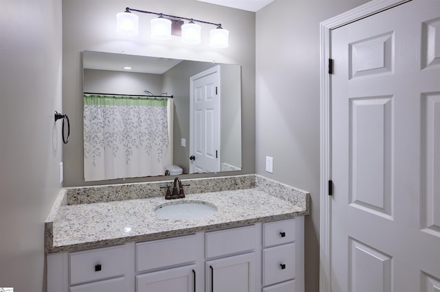 bathroom featuring vanity and walk in shower