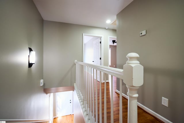 hallway with wood-type flooring