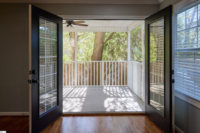 doorway to outside featuring french doors, hardwood / wood-style flooring, ceiling fan, and crown molding