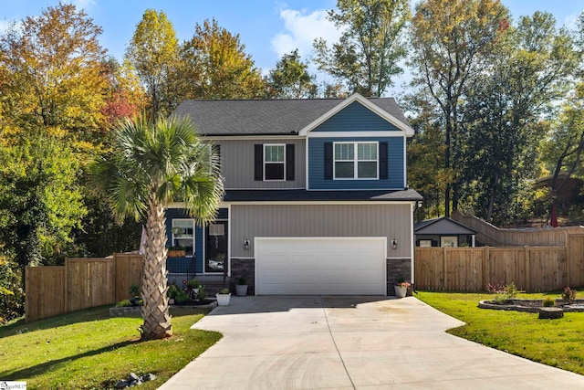 view of front facade with a garage and a front yard