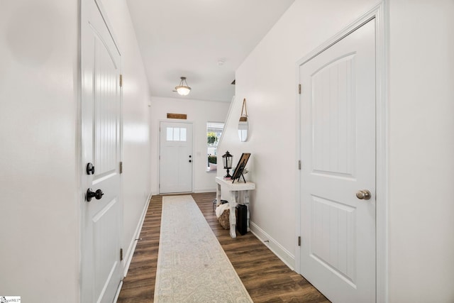 doorway with dark hardwood / wood-style floors