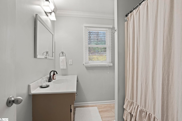 bathroom featuring vanity and ornamental molding