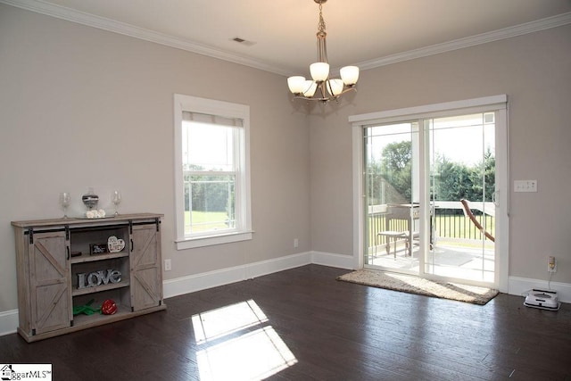 interior space featuring ornamental molding, dark hardwood / wood-style floors, and an inviting chandelier