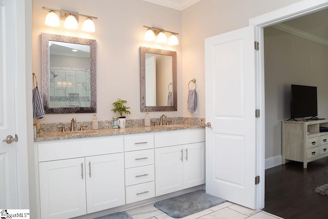 bathroom featuring vanity and ornamental molding