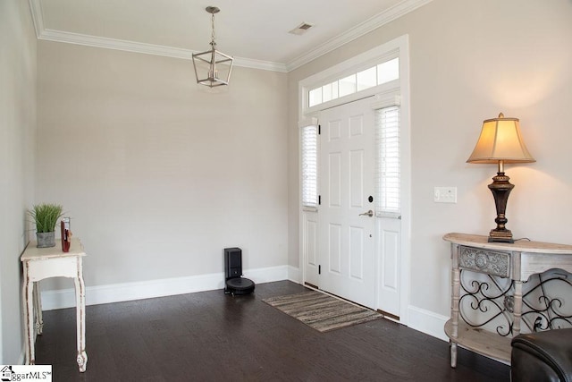 entrance foyer with dark hardwood / wood-style floors and crown molding