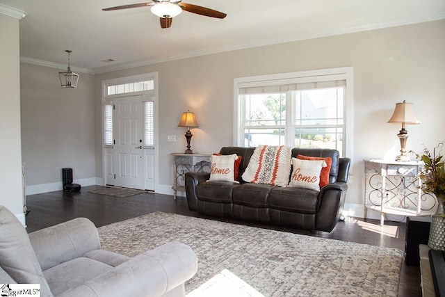 living room featuring ceiling fan, dark hardwood / wood-style flooring, and ornamental molding