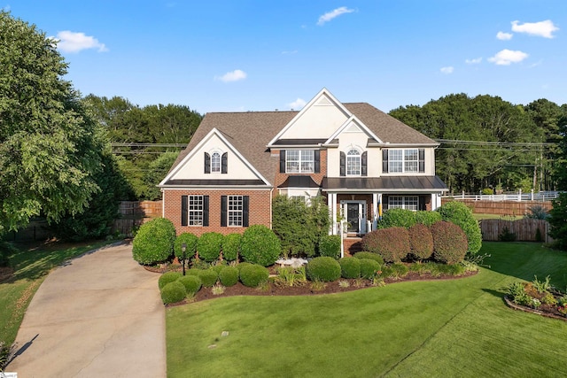 view of front of home featuring a front yard