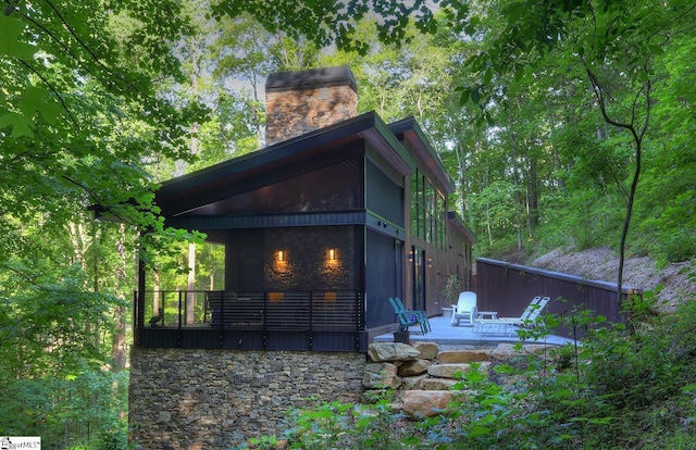 rear view of house featuring a patio area